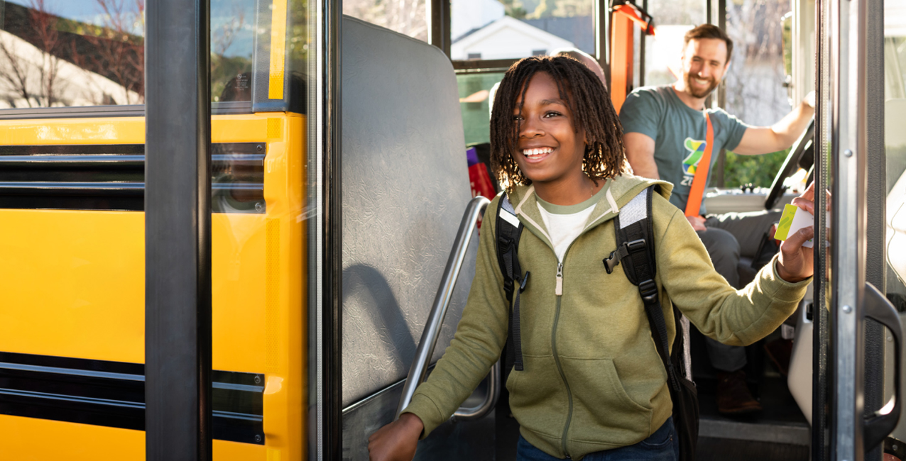 Young student exiting Zum bus