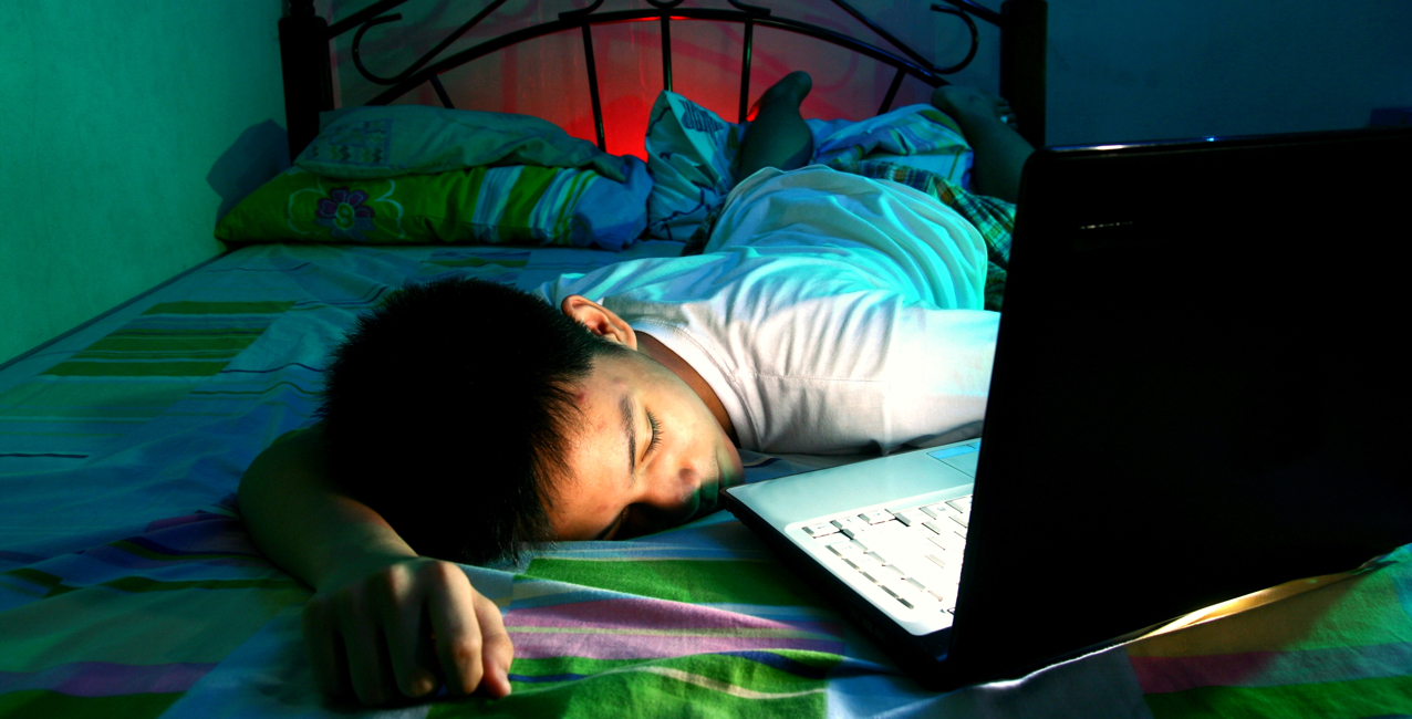 Student Sleeping in Front of Laptop